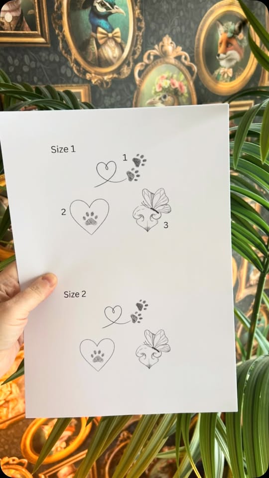 Inside Full Heart Tattoos & Coffees, Longford — dark studio walls, gold frames, plants and flash designs